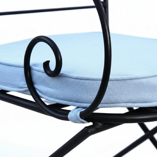 Detail du pied en fer forge du fauteuil ideal structure artisanale