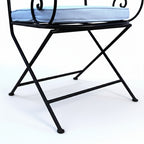 Detail du pied en fer forge du fauteuil ideal structure artisanale