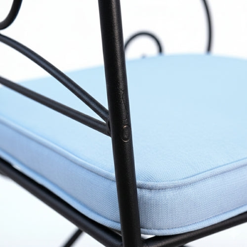 Detail du pied en fer forge du fauteuil ideal structure artisanale