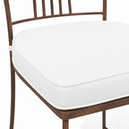 Detail du dossier moustache en fer forge artisanal avec finition rouille naturelle vernie