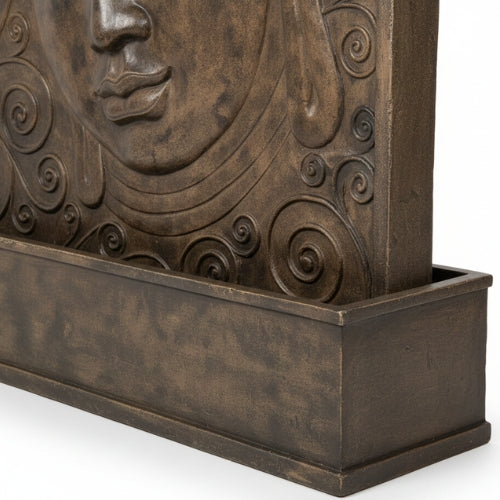 Fontaine murale Bouddha en GRC installée sur mur extérieur dans un espace professionnel à ambiance zen