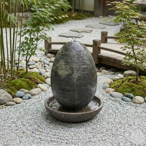 Fontaine ovale de jardin en résine ciment fibre de verre hauteur 150 cm vue d’ensemble extérieure