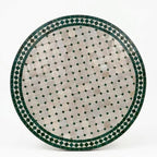 Table ronde en zellige Ø 100 cm Beige avec cabochon vert – Table artisanale en béton avec pied fixe en fer forgé noir
