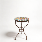Table haute extérieure en zellige multicolore Ø60 cm avec pied en fer forgé finition rouillée